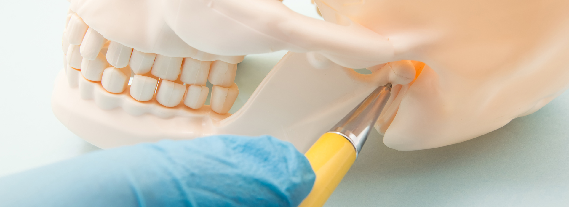 A person s teeth being worked on by a dental professional, with a focus on the cleaning and preparation process.